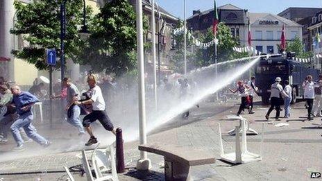 Police use water cannon on football fans