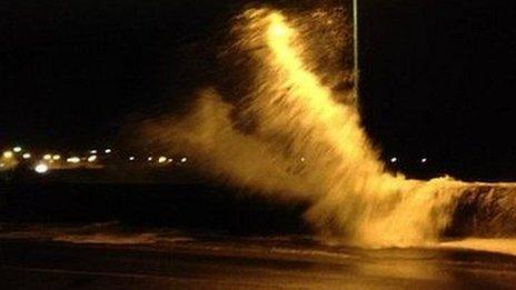 Waves crashed over harbour walls in Guernsey