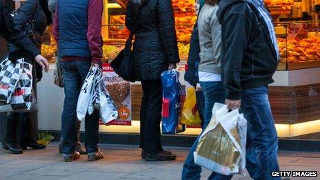 Shoppers pass a bakery in Hamburg