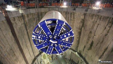 A tunnel boring machine being lowered into a site at East London