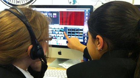 Schoolchildren working at a computer