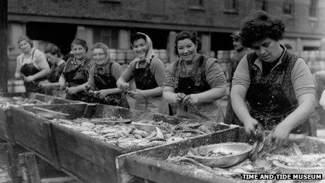 Women preparing the herring