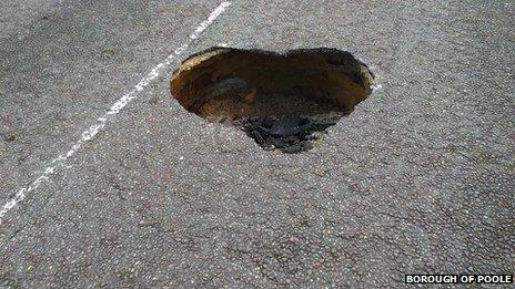 Heart-shaped hole in road