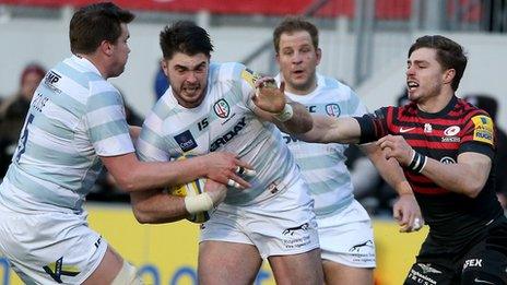 Eamonn Sheridan of London Irish takes on the Saracens defence