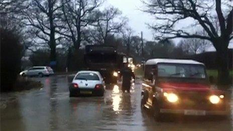 Soldiers helped pull cars from the flood water near Tostock