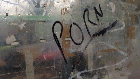 Porn graffiti on bus stop