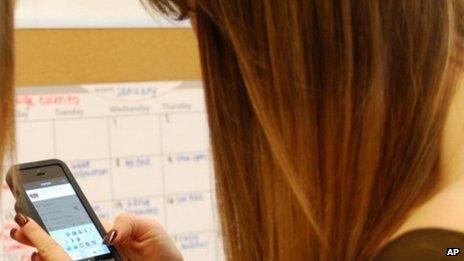 Girl looking at smartphone