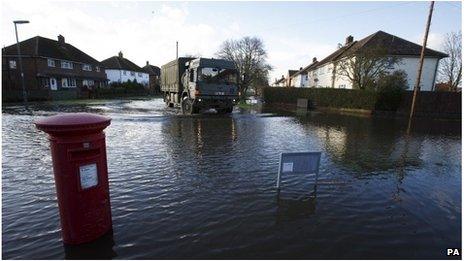 Army truck in flooded street in Egham