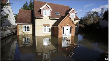 House surrounded by flood water in Egham