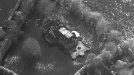 A highly detailed aerial picture of a flooded home captured by the RAF's Tornado jet