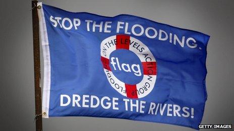 A protest flag asking for river dredging