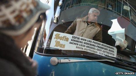 People prepare to board buses going abroad at the main bus station on December 7, 2013 in Sofia, Bulgaria