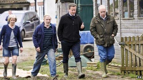 David Cameron, accompanied by Conservative MP Ian Liddell-Grainger, meets residents of the Somerset village of Othery