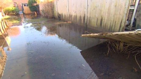 A flooded garden in Diglis Avenue