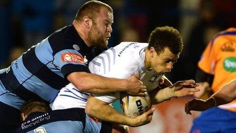 Zane Kirchner of Leinster is tackled by Scott Andrews and Sam Hobbs