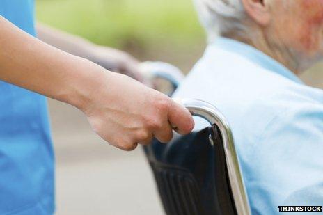 carer pushing wheelchair