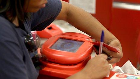 Woman at Target check out counter