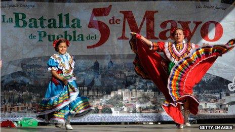 Two women dance during Cinco De Mayo festivities in Los Angeles, California, on 5 May 2011