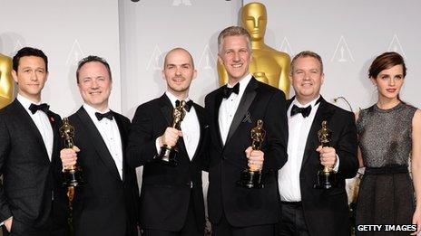 Visual effects artists Tim Webber, Chris Lawrence, David Shirk and Neil Corbould with Josph Gordon-Levitt (l) and Emma Watson (r)