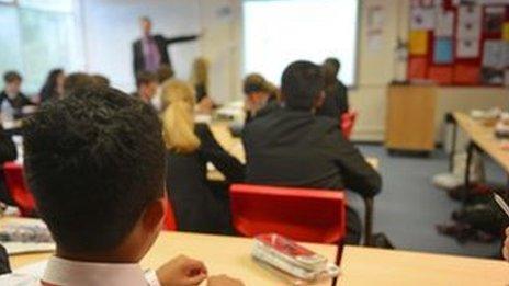 Teacher at board in classroom