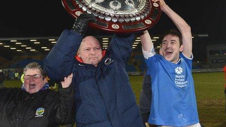 Linfield boss David Jeffrey lifts the Shield with captain Michael Gault