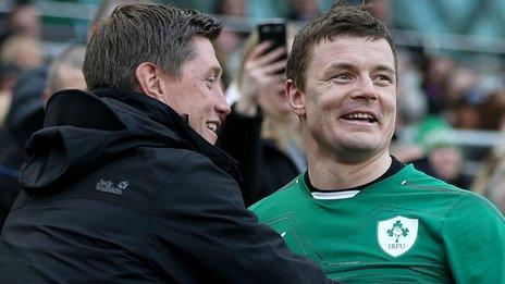 Former Ireland team-mate Ronan O'Gara congratulates Brian O'Driscoll