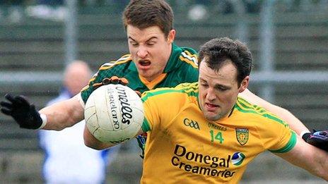 Meath's Sean Curran attempts to dispossess Donegal forward Michael Murphy