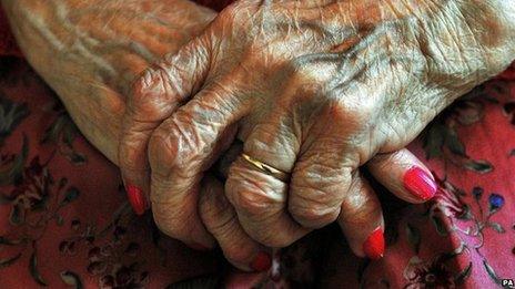 Close up on the hands of an elderly woman