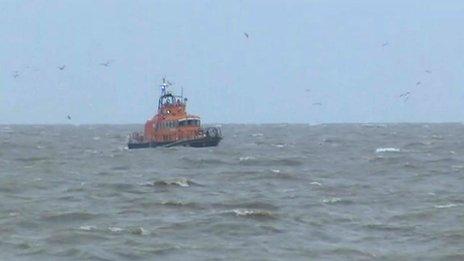 Lifeboat searching for people in the sea off Lowestoft