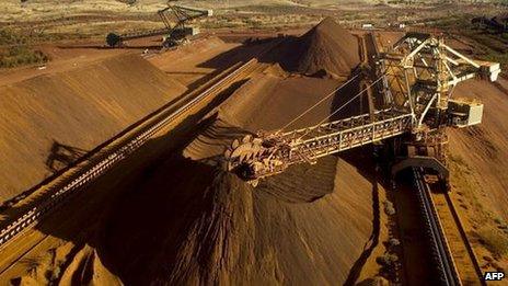 A conveyor belt loading iron ore