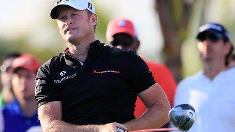 Jamie Donaldson looks stern after hitting a tee-shot during the WGC- Classic