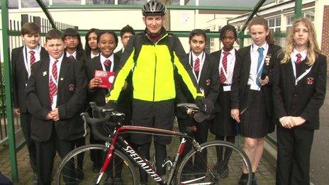 Group of School reporters and a cyclist