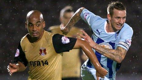 Leyton Orient's Elliot Omozusi and Coventry's Carl Baker