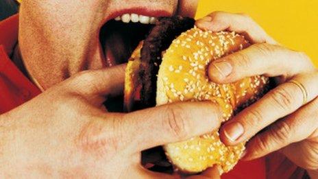 Man eating hamburger