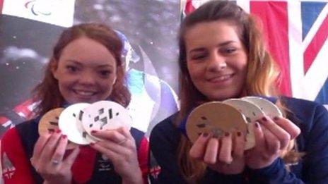 Jade Etherington (left) and Caroline Powell holding their Paralympic medals