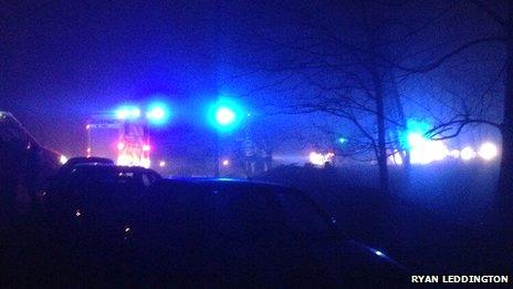 Emergency service vehicles at the scene of the helicopter crash