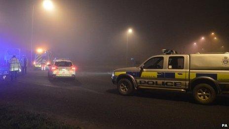 Police vehicles near crash scene