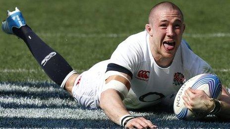 Mike Brown celebrates as England score