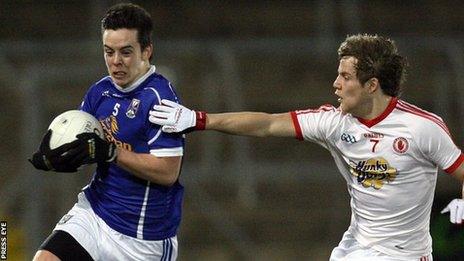 Cavan's Gerry Smith is challenged by Kieran McGeary of Tyrone