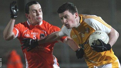 Armagh's Donal O'Neill tackles Dermot McAleese of Antrim