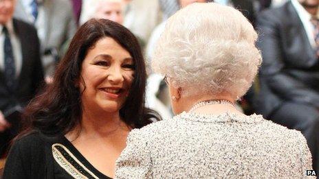 Kate Bush receives a CBE from the Queen