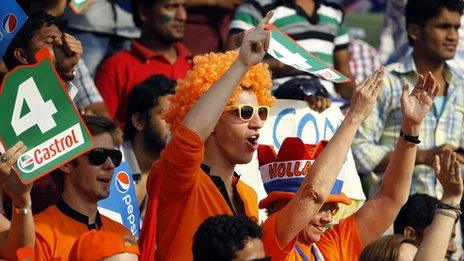 Fans of the Netherlands cheer their team on