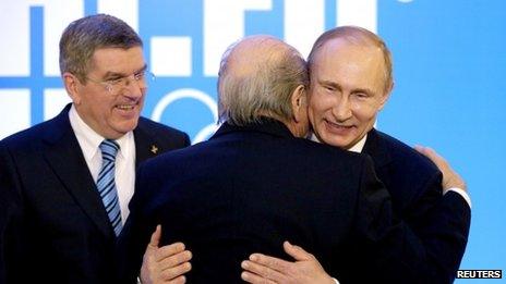 Sepp Blatter embraces Vladimir Putin at the 2014 Winter Olympics