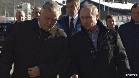 Russia's President Vladimir Putin (R) walks with Russian Railways President Vladimir Yakunin (L) during his visit to a recently constructed train station in Sochi (January 4, 2014)