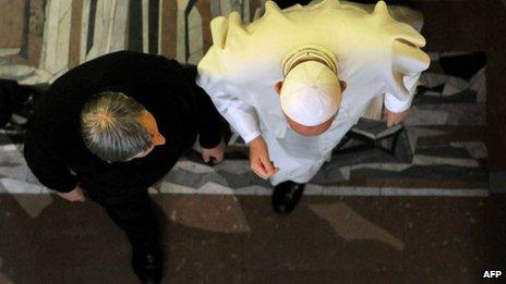 Pope Francis (right) leaves the church in Rome with Father Luigi Ciotti of the Catholic Libera association