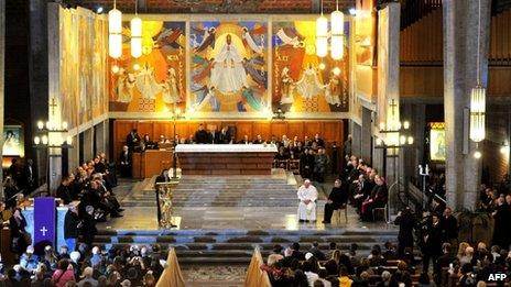 Pope Francis (centre right) attends the service