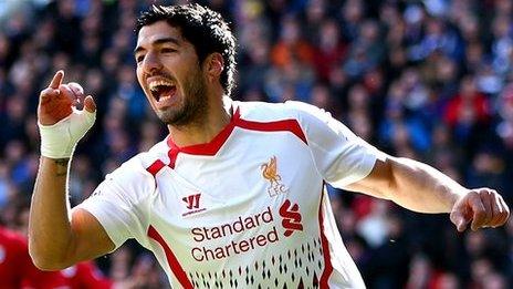 Luis Suarez celebrates at Cardiff