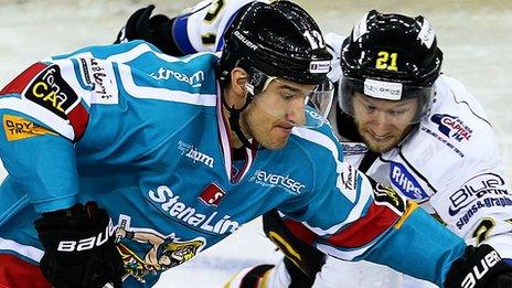 Jeffrey Szwez of the Belfast Giants in action against Matt Ryan of the Nottingham Panthers