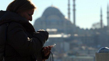 Lady using phone in Turkey