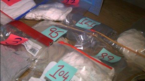 Numbered bags containing t-shirts